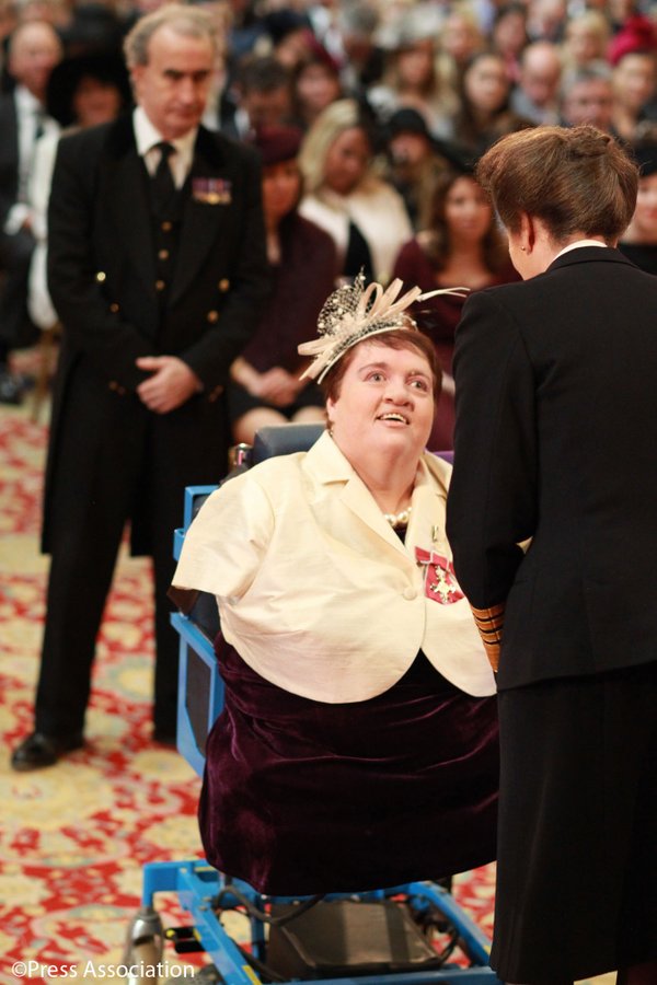 Lorraine Mercer receiving her MBE from Princess Anne
