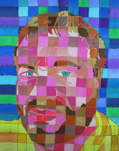 Self portrait of mouth and foot artist tom Yendell, painted in squares of striking colours