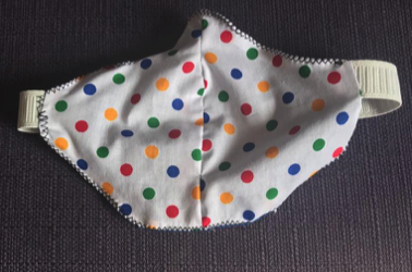 face mask made of spotted material with single elastic strap