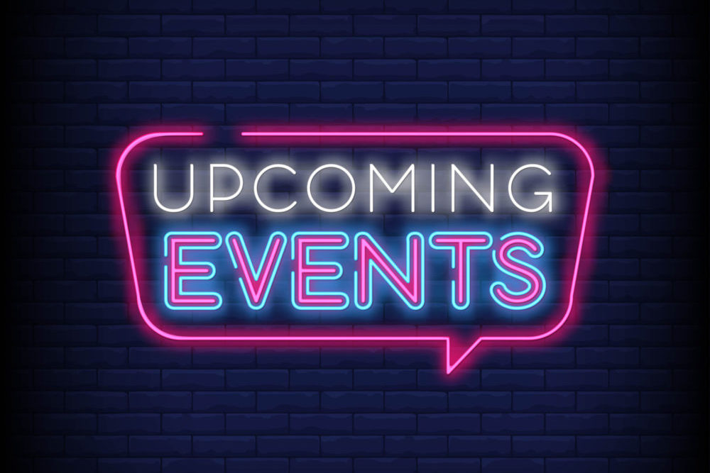 Neon sign of a speech balloon with the words Upcoming Events