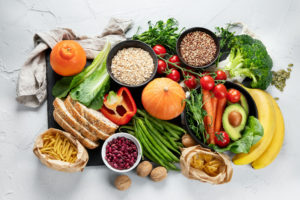 A platter of fruit, vegetables, pulses, bread and pasta which are high in fibre