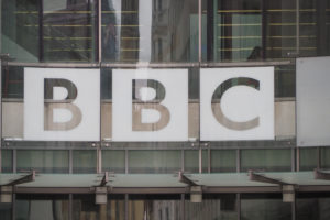 BBC logo in glass on the front of their headquarters in London