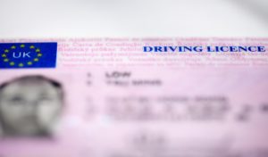 out of focus shot of a UK photo card driving licence