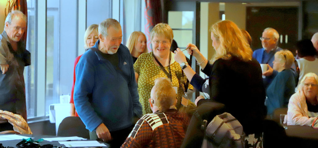 beneficiaries and Trust staff chatting at the Scotland local event