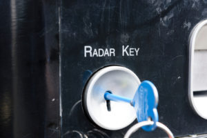Radar key sticking out of a keyhole